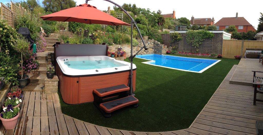 Artificial grass surrounds for swimming pools and hottubs
