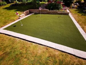 putting green with paving perimeter