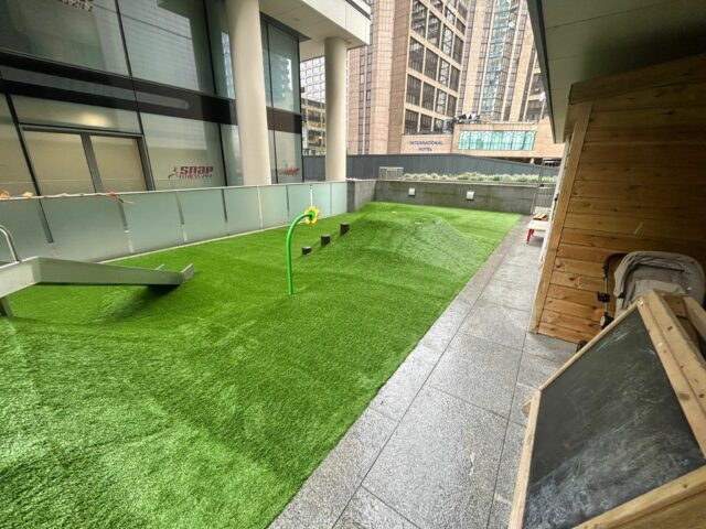 Artificial grass with slide in it