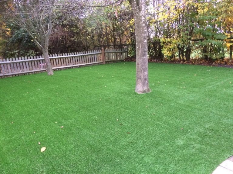 shaded artificial grass play area