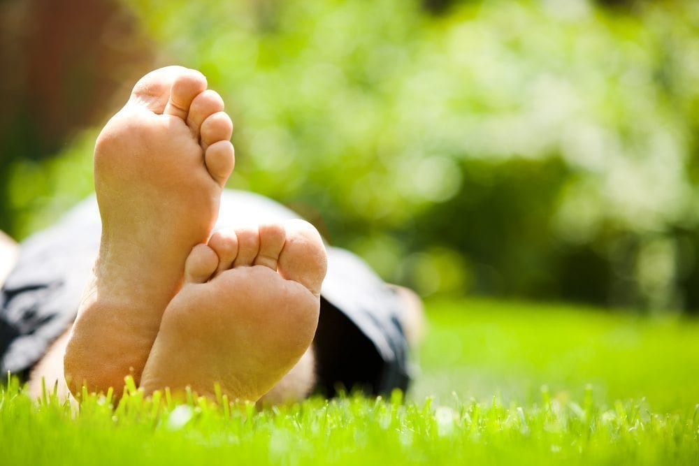 Laying on lawn feet up