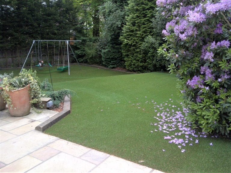 Artificial grass with home play equipment